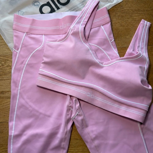 Alo Yoga pink matching set with sports bra and high-waisted leggings