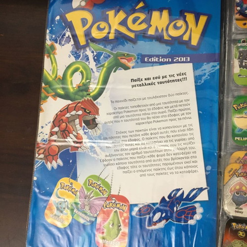 Pokémon album with metal tags used