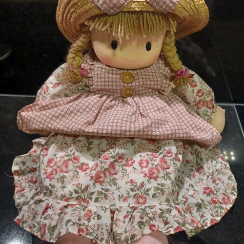 Doll like new with cotton clothes and straw hat
