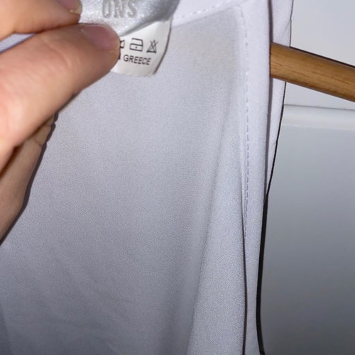Top white used Danoff one size with perforated details