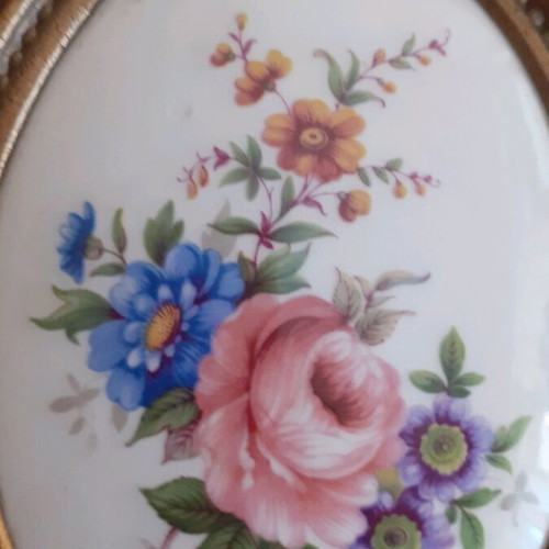 Porcelain miniatures like new with bronze border
