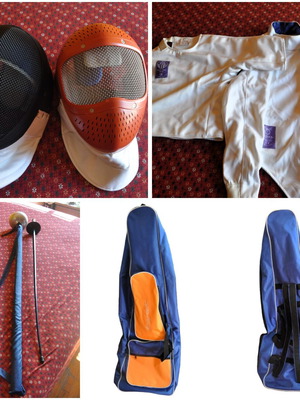 Fencing kit used with 2 swords, 2 helmets, bag and uniform