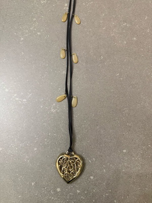 Long heart necklace with black cord like new, gold color