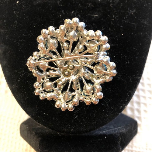 Flower brooch with turquoise stones like new