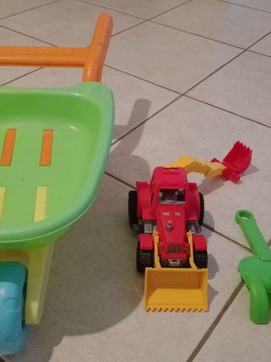 Beach toy set: plastic wheelbarrow, shovel, rake, small excavator