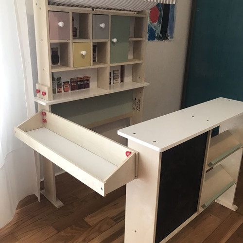 Wooden play shop with accessories and blackboard
