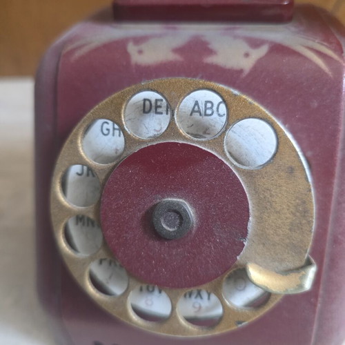 Metal telephone used, red, wired connection