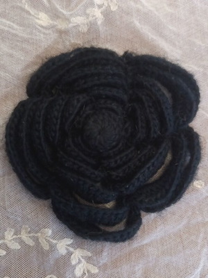 Knitted black rose brooch used