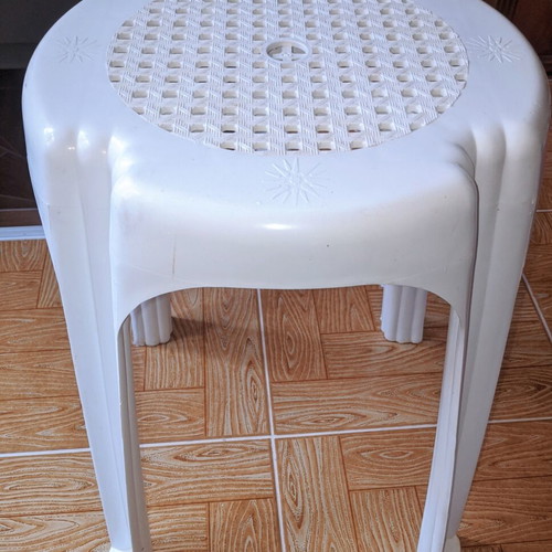 Plastic stool used, low balcony and garden table white