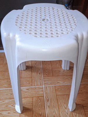 Plastic stool used, low balcony and garden table white