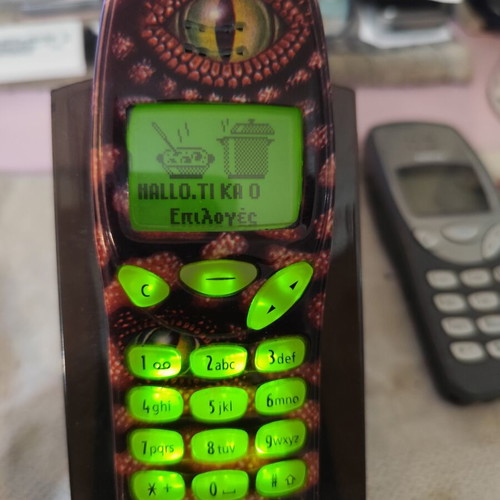 Nokia 3210 vintage cell phone used with new battery and front cover