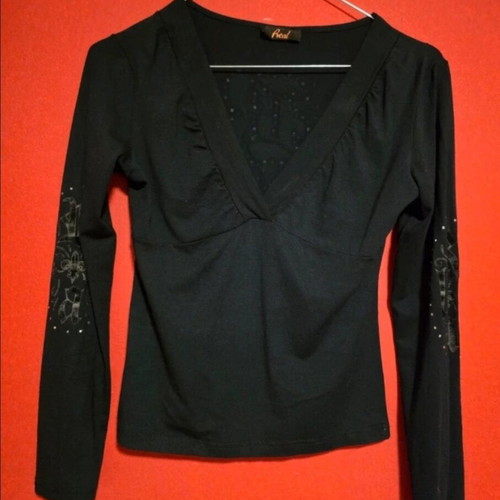 Black top with prints and rhinestones like new