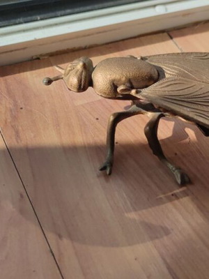Vintage brass fly ashtray with opening wings, used