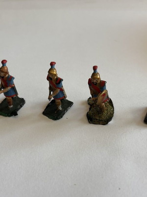Set of 4 used hand-painted metal miniature warriors