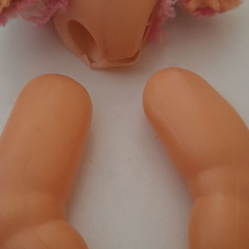 Vintage plastic baby doll from the 70s used with handmade sweater and hat