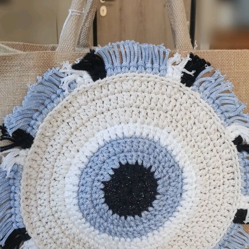 Jute bag with knitted decorative eye and waterproof lining