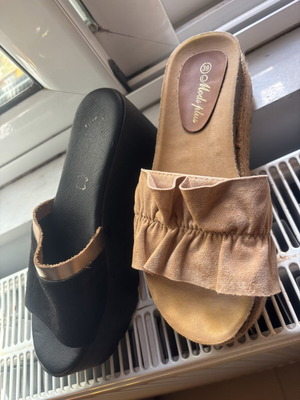 Set of two pairs of clogs used, size 39, black and gold