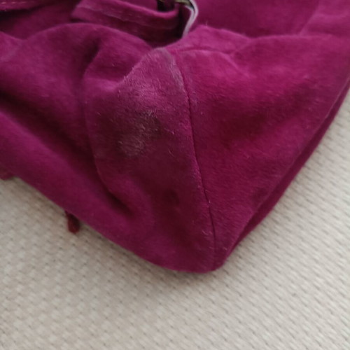 Leather backpack fuchsia used with some wear