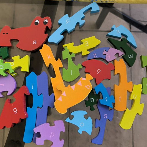 Wooden puzzle construction with letters and numbers