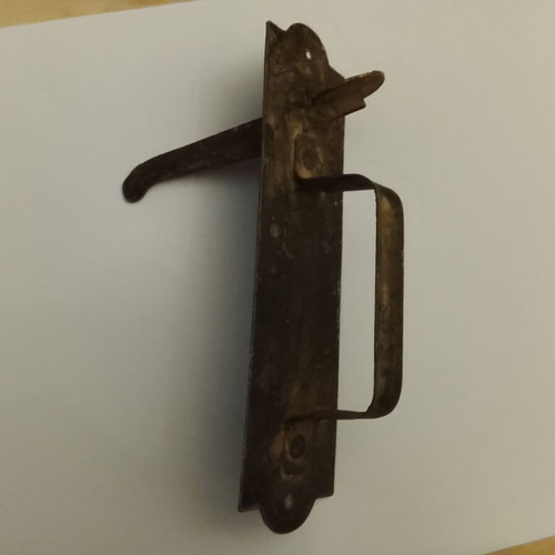 Traditional door handle-latch used