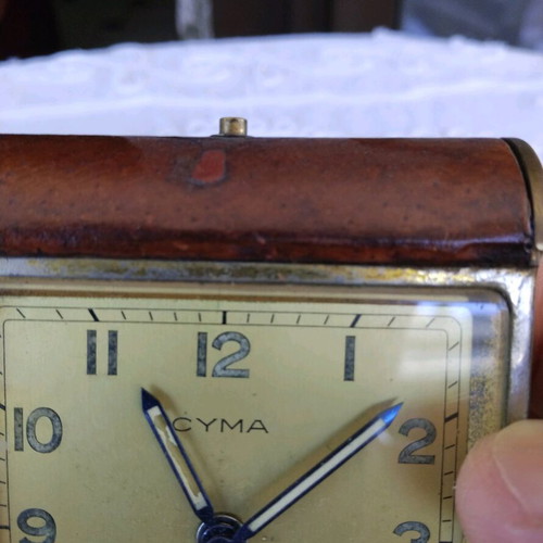 Cyma table clock used, Swiss made, brass with leather