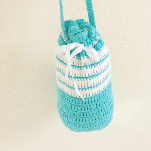 Handmade turquoise knitted pouch toiletry bag used