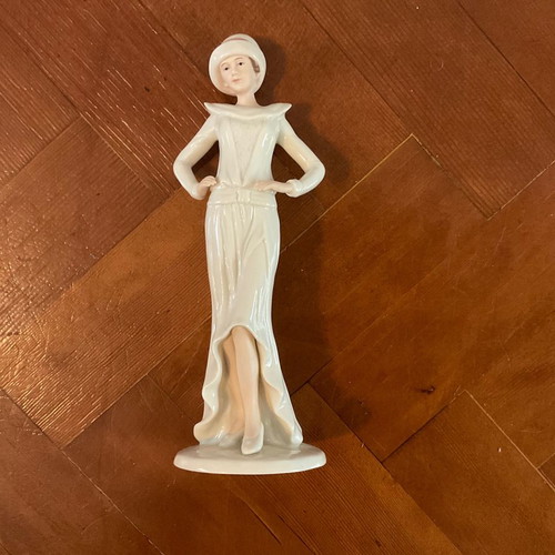 Regal Porcelain Statue
