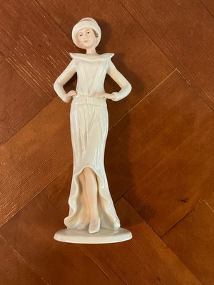 Regal Porcelain Statue