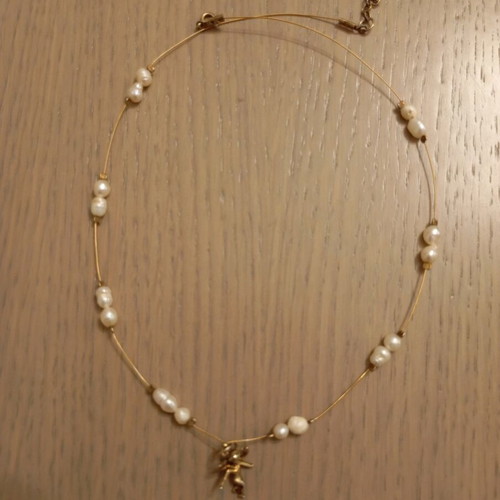 Necklace with angel design and small pearls like new