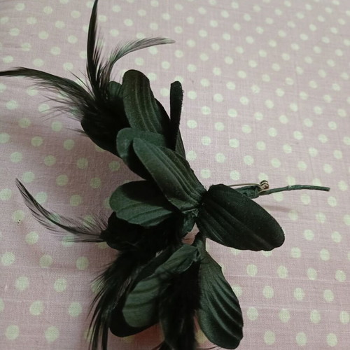Pins used with feathers in black and red