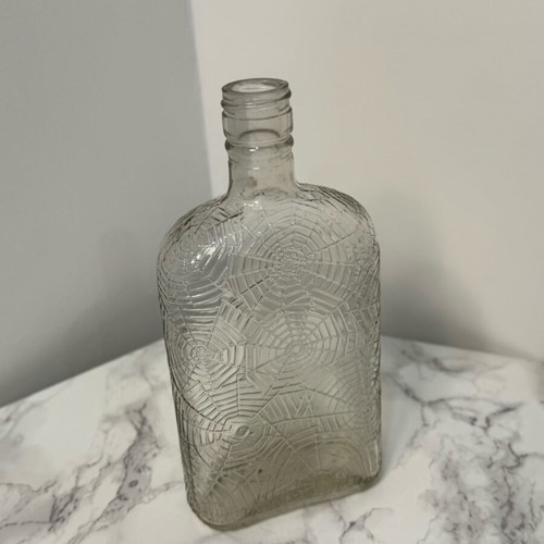 Vase bottle with engraved spiderwebs used