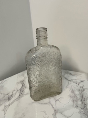 Vase bottle with engraved spiderwebs used