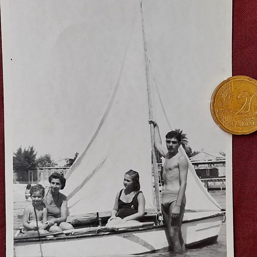 Vintage black and white photo of group on small sailboat, like new