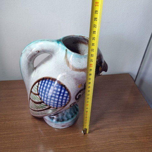 Ceramic owl pitcher used, broken and glued on the beak