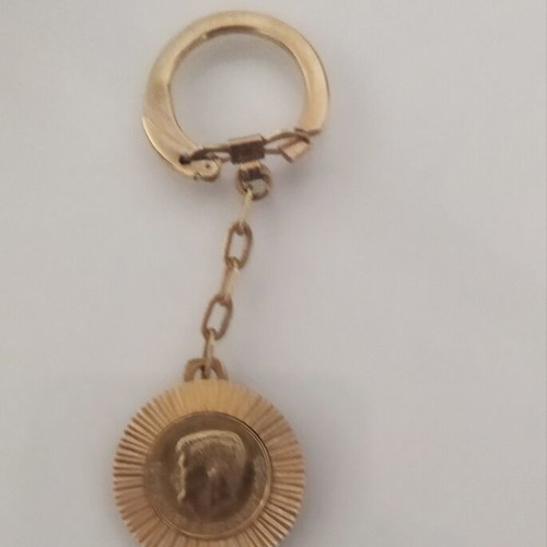 Kennedy keychain used, gold color