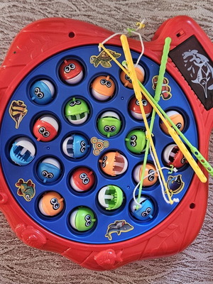 The Fishing Game board game with colorful fish and fishing rods