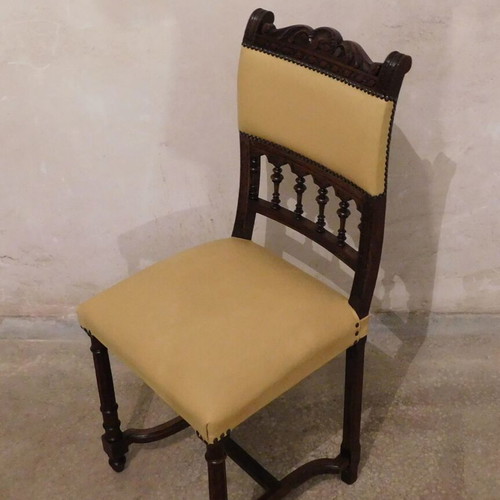 Wood-carved chair with leather seat like new, about 100 years old