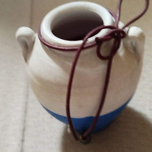 Decorative two-tone miniature clay vase used, white and blue