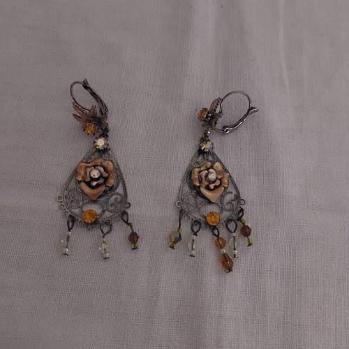 Earrings used with stones, missing 2 rows on one