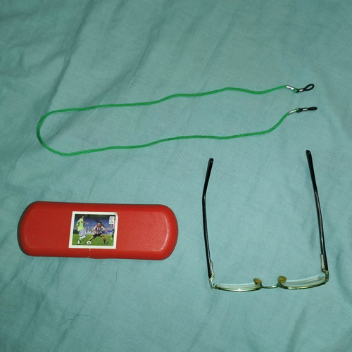 Children's prescription glasses used, black and green