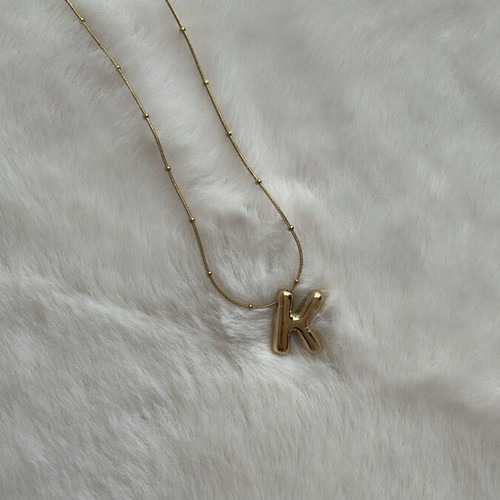 Monogram necklace new unworn, gold color