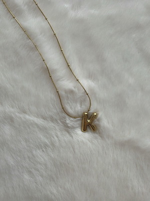 Monogram necklace new unworn, gold color