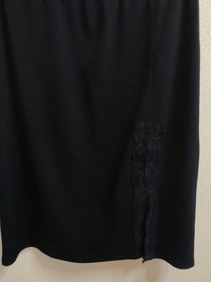 Knee-length skirt used, black with lace and front slit