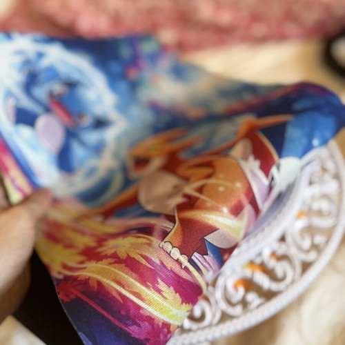 Pokémon mousepad with Charizard and Sneasel design