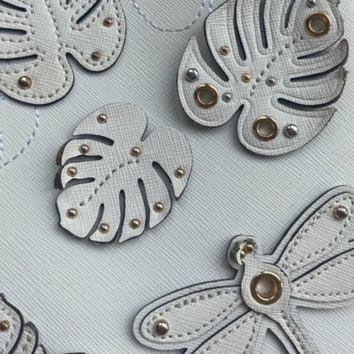 Michael Kors white tote bag with floral and dragonfly details