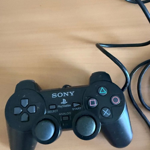 PlayStation 2 Slim console with original Sony accessories