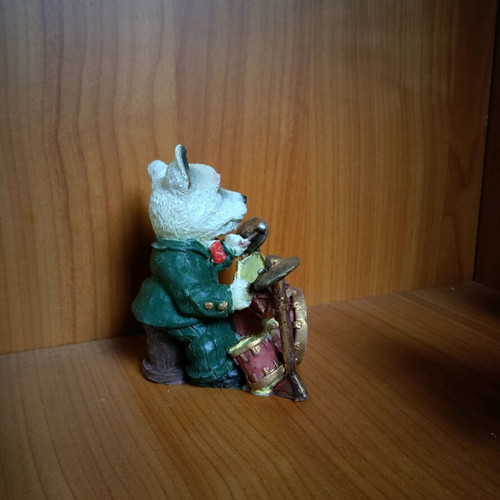 Decorative dog figure with drums like new