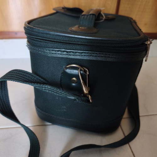 Toiletry bag used, green, fabric defect
