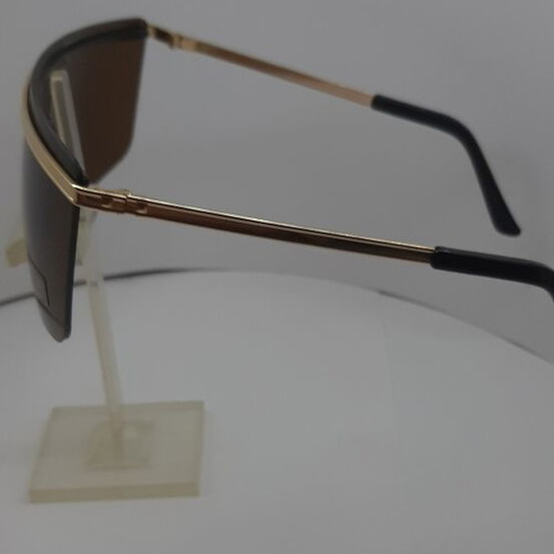 Sunglasses like new, black frame with gold details and brown lenses