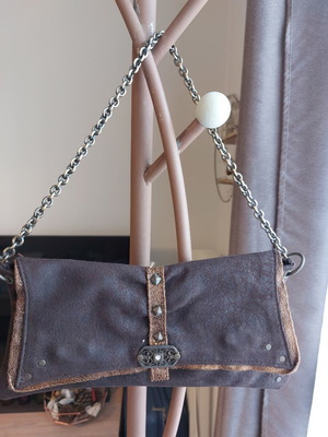 Leather women's clutch bag like new, brown with metal details and chain